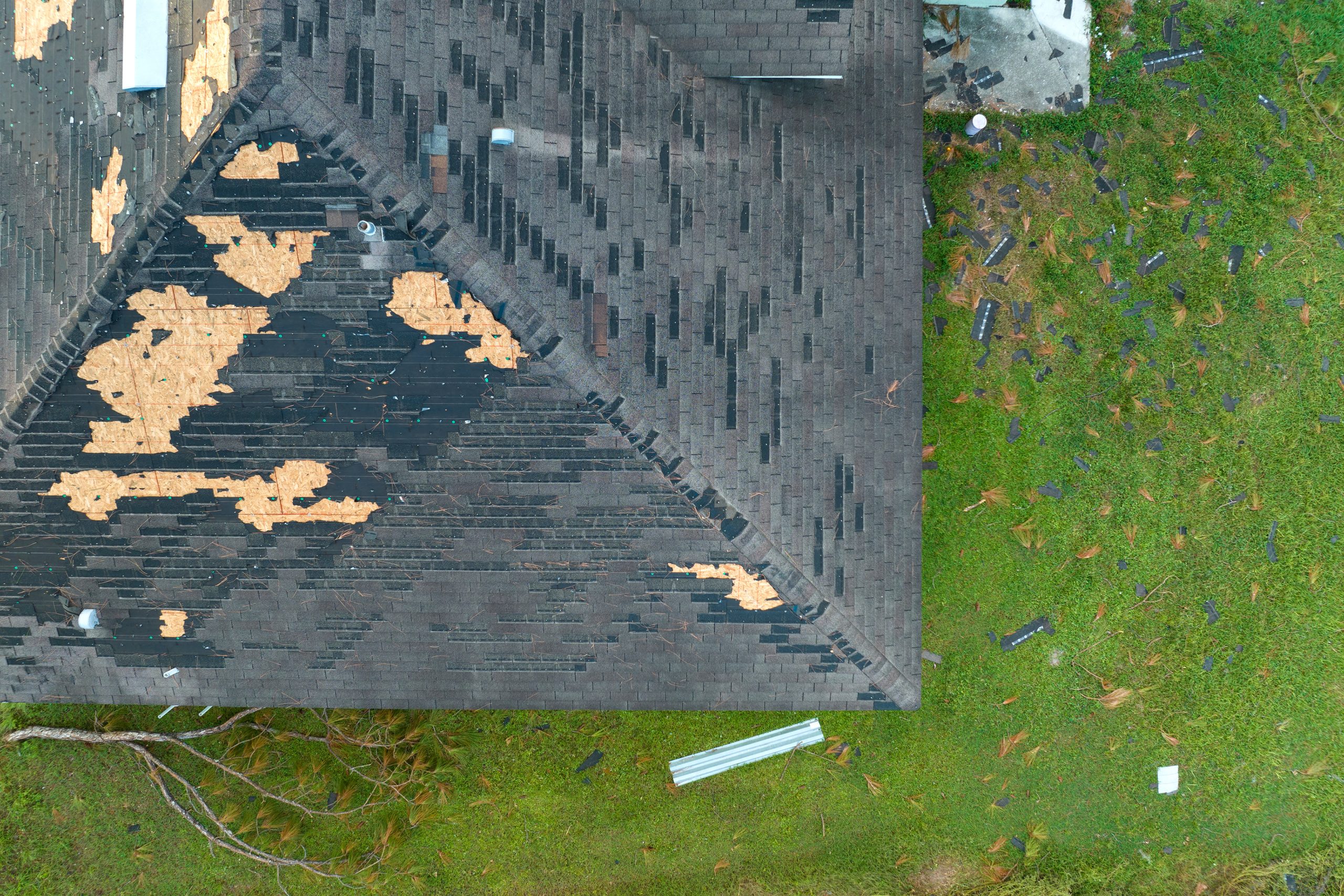 missing asphalt shingles after hail storm damage