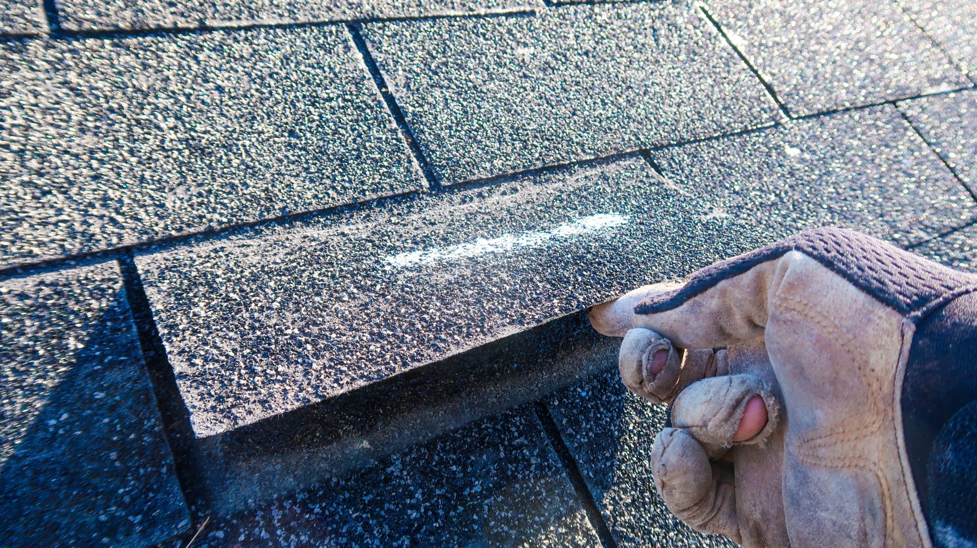 Residential roof inspection of loose roof shingles